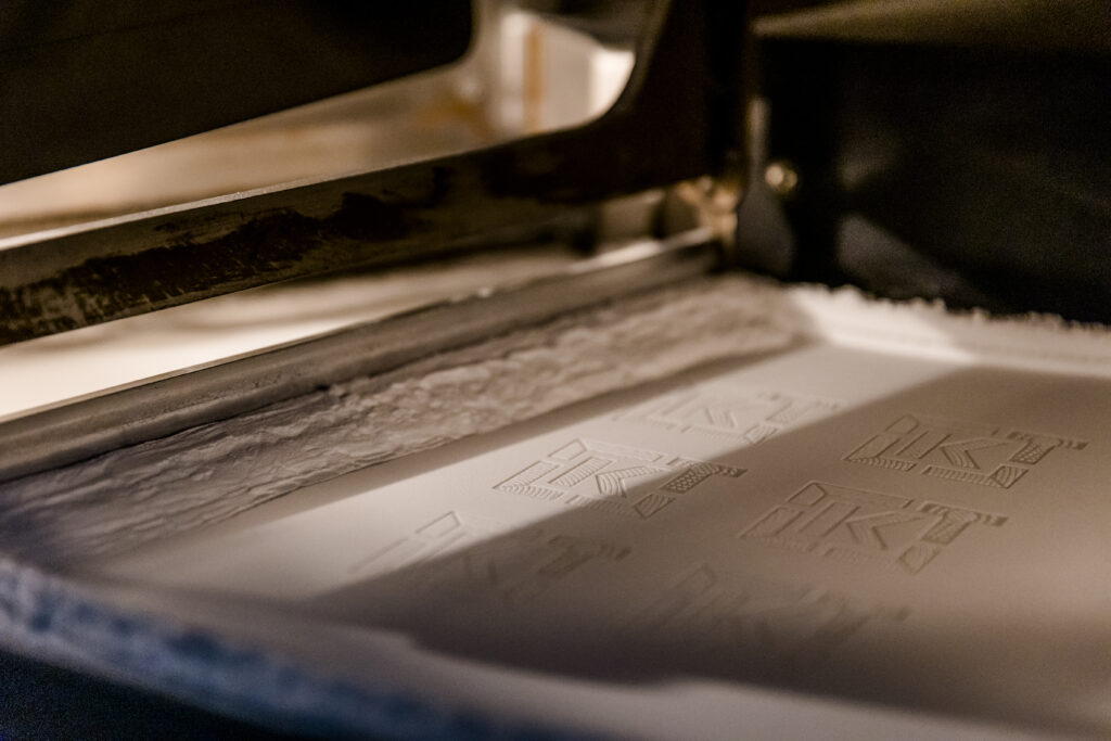 Powder bed-based additive manufacturing