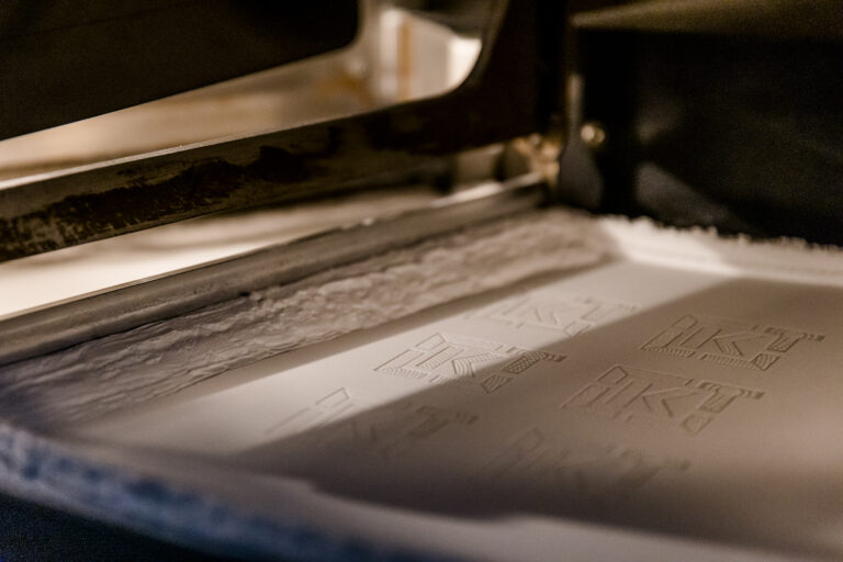 Powder bed-based additive manufacturing